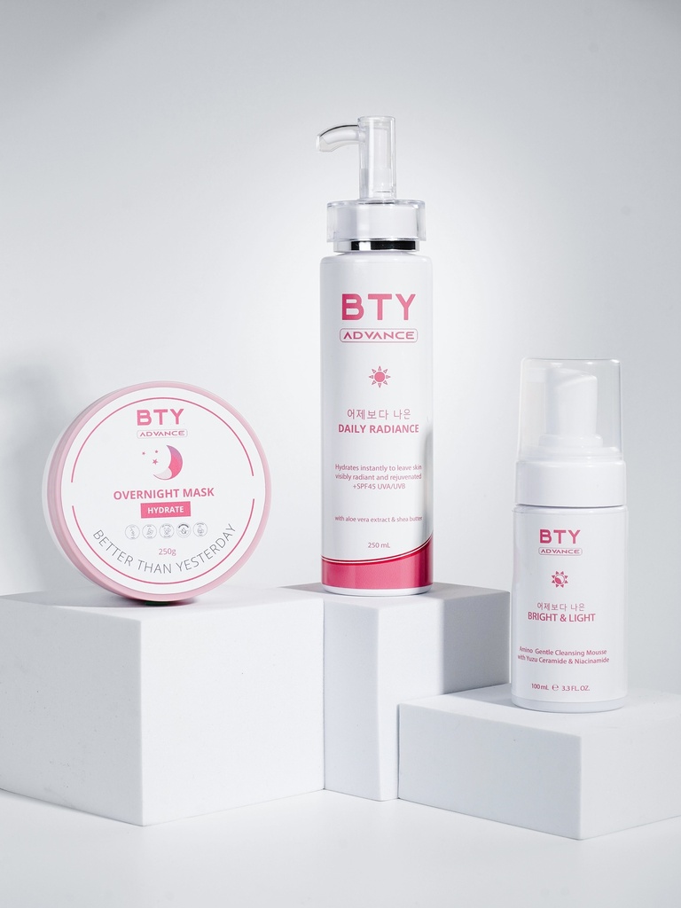 BTY Advance Bright & Light, Daily Radiance, and Overnight Mask on a dark table