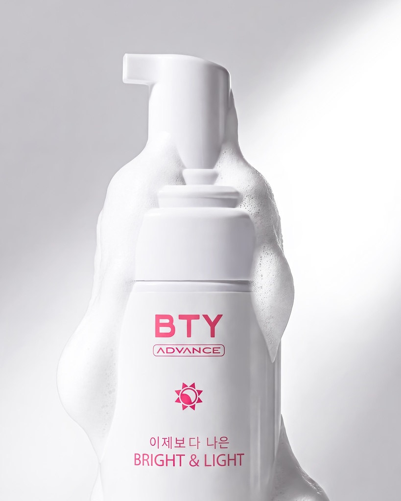 BTY Advance Bright & Light Cleanser on a stack of books