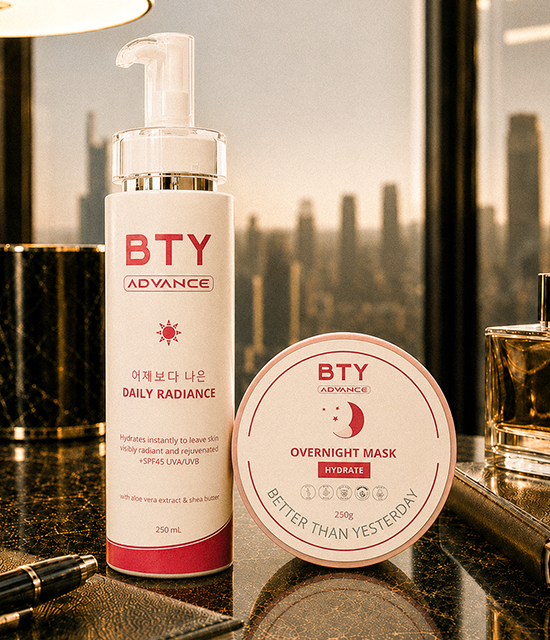 BTY Advance Daily Radiance and Overnight Mask on a dark table with a city view