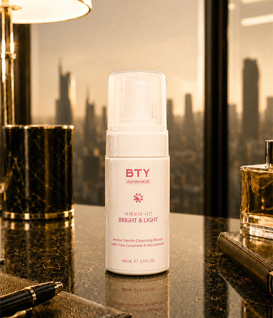 BTY Advance Bright & Light Cleanser on a dark table with a city view