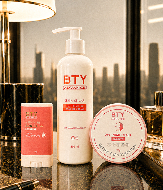 BTY Advance Instaglow, Overnight Mask, and Sun Stick on a dark table with a city view